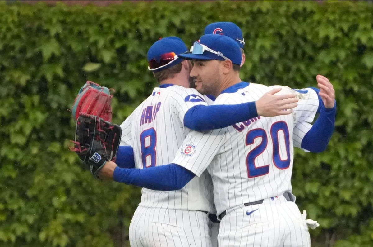 May 7, 2026; Chicago, Illinois, USA; Chicago Cubs right fielder Michael Conforto (20) celebrates the Cubs win against the Cincinnati Reds with left fielder Ian Happ (8) at Wrigley Field. Mandatory Credit: David Banks-Imagn Images