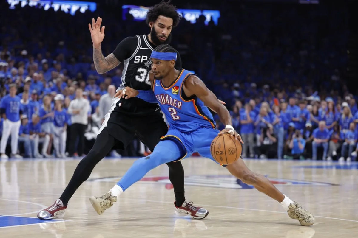 May 30, 2026; Oklahoma City, Oklahoma, USA; Oklahoma City Thunder guard Shai Gilgeous-Alexander (2) controls the ball against San Antonio Spurs forward Julian Champagnie (30) in the fourth quarter during game seven of the western conference finals for the 2026 NBA playoffs at Paycom Center. Mandatory Credit: Alonzo Adams-Imagn Images