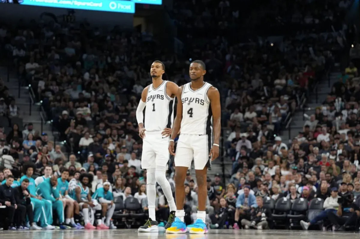 Mar 14, 2026; San Antonio, Texas, USA; San Antonio Spurs forward Victor Wembanyama (1) and guard De'aaron Fox (4) look back up the court in the second half against the Charlotte Hornets at Frost Bank Center. Mandatory Credit: Daniel Dunn-Imagn Images