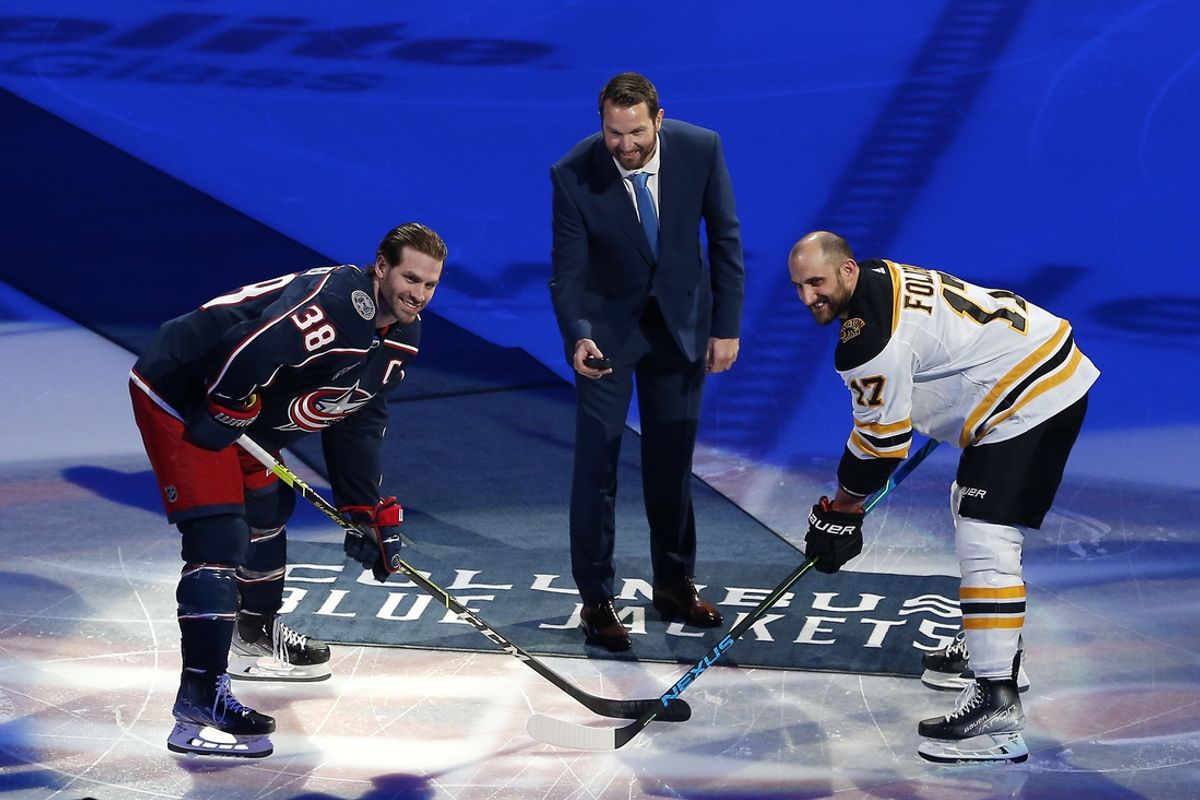 Mar 5, 2022; Columbus, Ohio, USA; Former Columbus Blue Jackets forward Rick Nash drops the ceremonial puck with Columbus Blue Jackets center Boone Jenner (38) and Boston Bruins left wing Nick Foligno (17) before the start of the first period at Nationwide Arena. Mandatory Credit: Russell LaBounty-Imagn Images