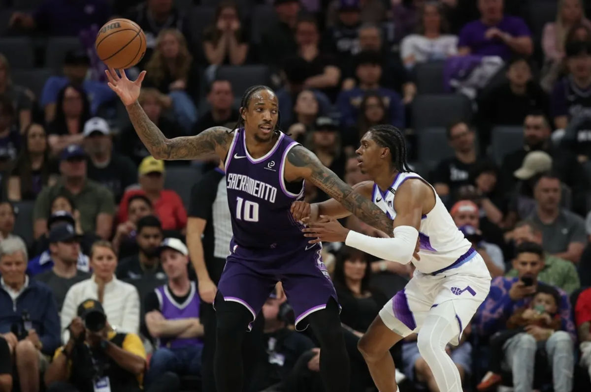 Mar 15, 2026; Sacramento, California, USA; Sacramento Kings guard-forward DeMar DeRozan (10) catches the ball while being defended by Utah Jazz forward Cody Williams (5) during the fourth quarter at Golden 1 Center. Mandatory Credit: Dennis Lee-Imagn Images