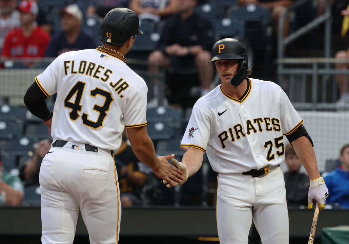 Aug 16, 2026; Pittsburgh, Pennsylvania, USA; Pittsburgh Pirates center fielder Billy Cook (25) greets first baseman Rafael Flores Jr. (43) crossing home plate to score a run against the Boston Red Sox during the seventh inning at PNC Park. Mandatory Credit: Charles LeClaire-Imagn Images