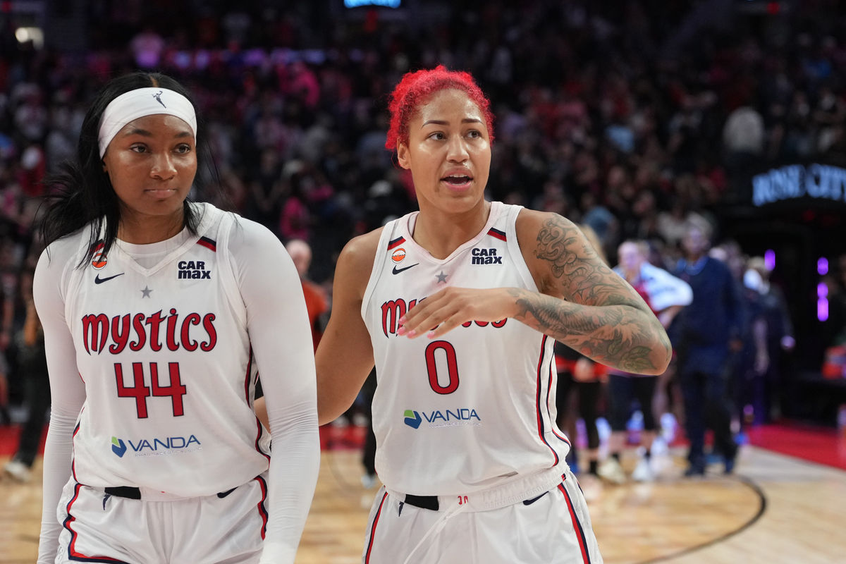Aug 23, 2026; Portland, Oregon, USA; Washington Mystics center Shakira Austin (0) leaves the court with teammate Kiki Iriafen (44) after a win over the Portland Fire at Moda Center. Mandatory Credit: Soobum Im-Imagn Images