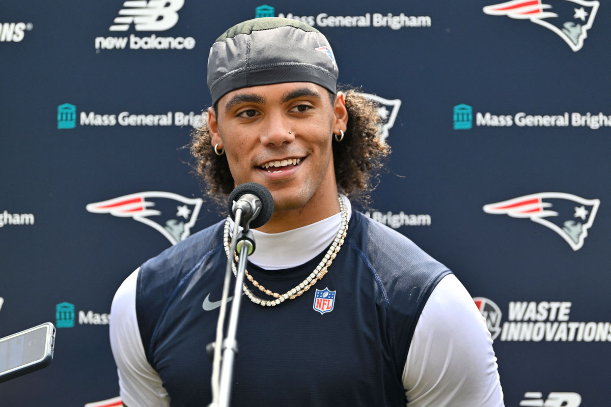 Jul 28, 2026; Foxborough, MA, USA; New England Patriots cornerback Christian Gonzalez (0) speaks to the media after practice at training camp at Gillette Stadium. Mandatory Credit: Eric Canha-Imagn Images