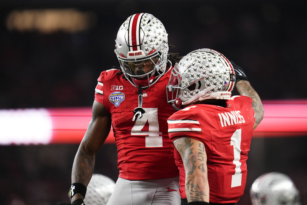 Ohio State Buckeyes wide receiver Brandon Inniss (1) celebrates a touchdown by wide receiver Jeremiah Smith (4) during the Cotton Bowl at AT&T Stadium in Arlington, Texas for the College Football Playoff quarterfinal game against the Miami Hurricanes on Dec. 31, 2025. Ohio State lost 24-14.