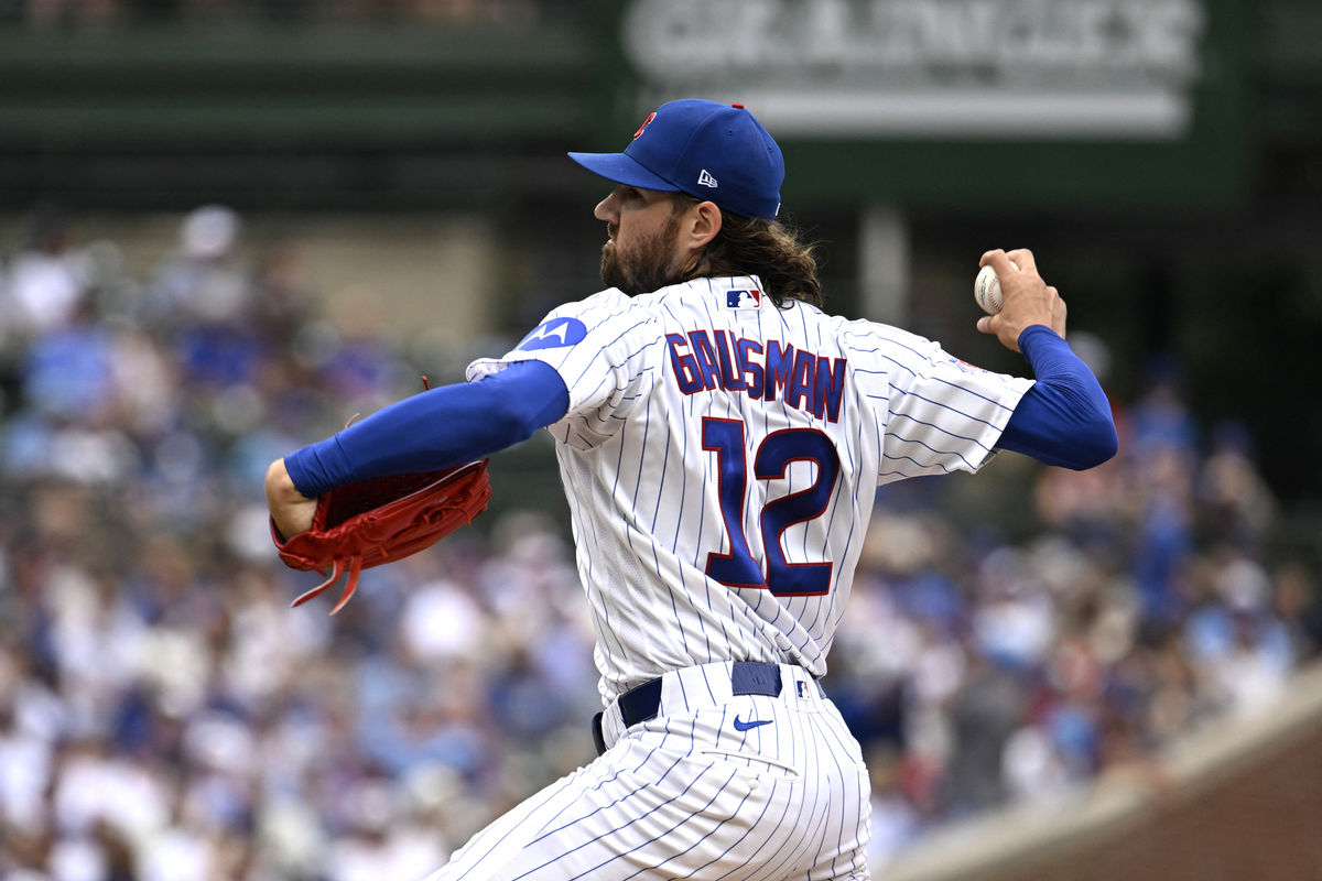 Aug 29, 2026; Chicago, Illinois, USA; Chicago Cubs pitcher Kevin Gausman (12) delivers the ball during the first inning against the Cincinnati Reds at Wrigley Field. Mandatory Credit: Matt Marton-Imagn Images