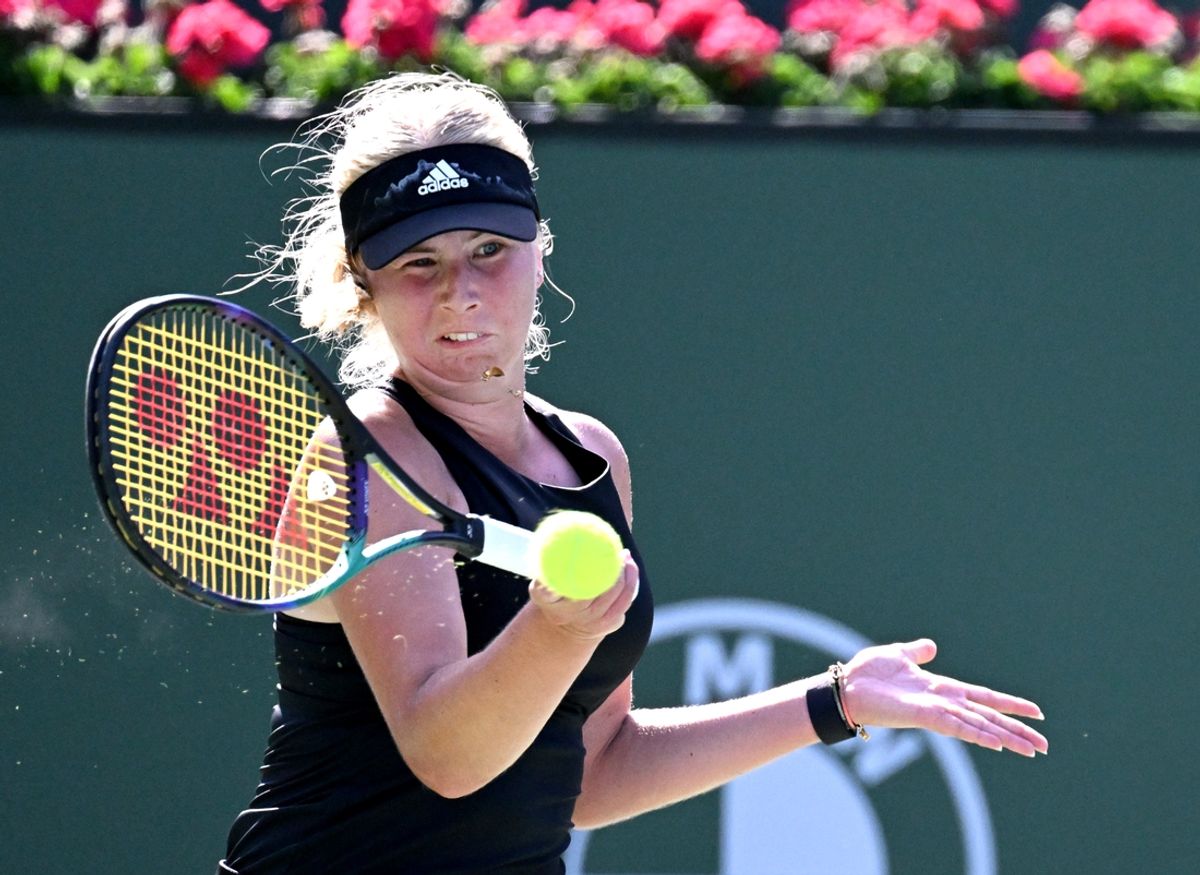 Mar 13, 2022; Indian Wells, CA, USA; Clara Tauson (DEN) hits a shot during her third round match against  Iga Swiatek (POL) at the BNP Paribas Open at the Indian Wells Tennis Garden. Mandatory Credit: Jayne Kamin-Oncea-Imagn Images