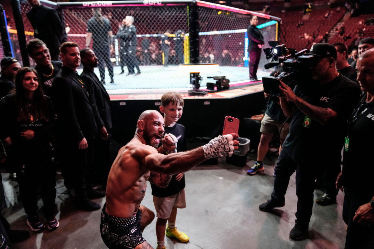 Jean Silva and Sebastian Hinojosa, 8, pose for a selfie after Silva beat Jose Miguel Delgado during Noche UFC at Desert Diamond Arena in Glendale, on Sept. 12, 2026.