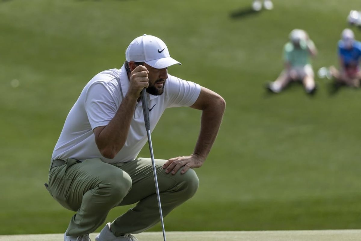 Mar 17, 2024; Ponte Vedra Beach, Florida, USA; Scottie Scheffler lines up a putt on the 3rd green during the final round of THE PLAYERS Championship golf tournament.