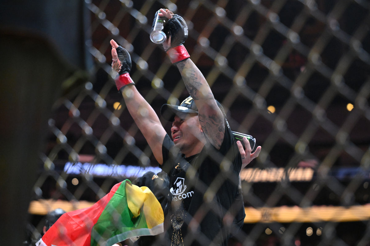 Sep 19, 2026; Los Angeles, California, USA; Joshua Van (red gloves) reacts after defeating Alexandre Pantoja (not pictured) in the flyweight title bout during UFC 331 at Crypto.com Arena. Mandatory Credit: Griffin Hooper-Imagn Images