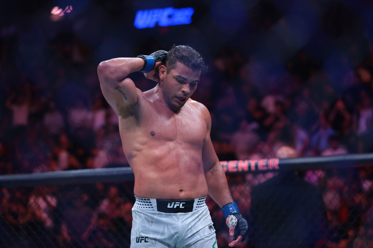 Apr 11, 2026; Miami, Florida, UNITED STATES; Paulo Costa (blue gloves) reacts after defeating Azamat Murzakanov (red gloves) during UFC 327 at Kaseya Center. Mandatory Credit: Sam Navarro-Imagn Images