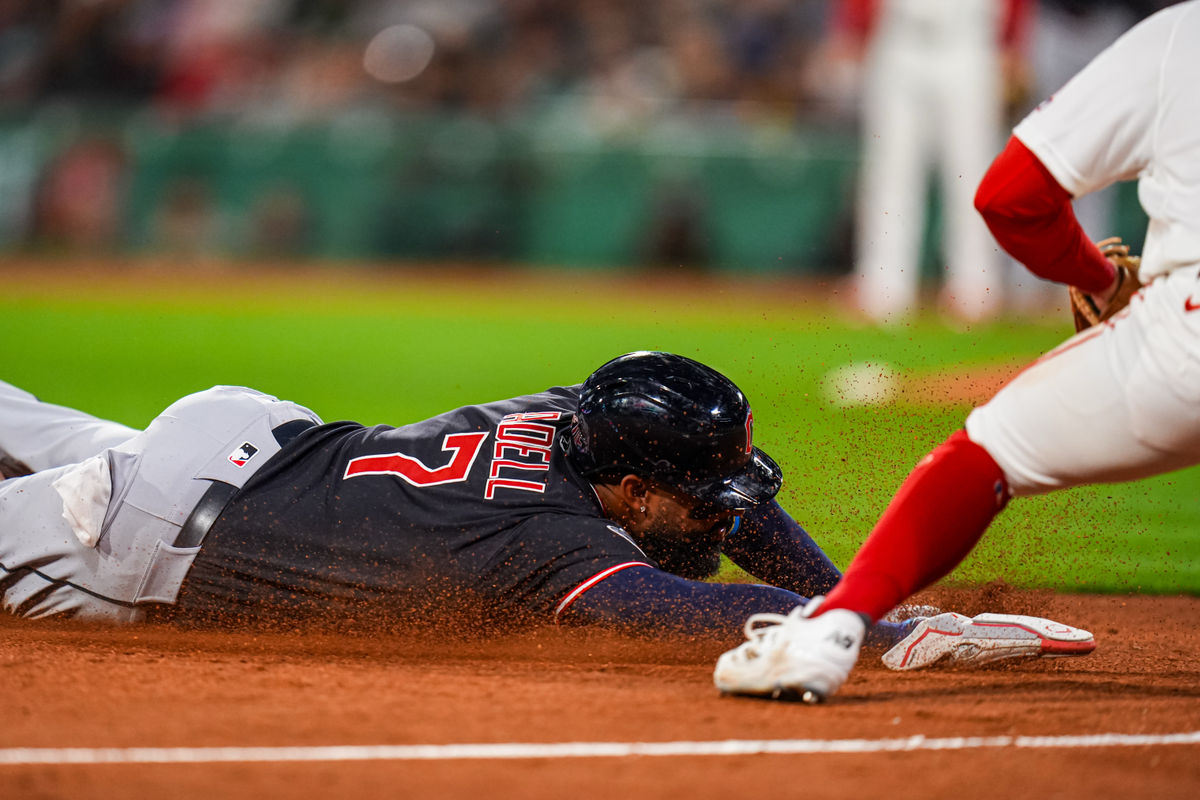 Sep 22, 2026; Boston, Massachusetts, USA; Cleveland Guardians designated hitter Jo Adell (7) safe at third base Boston Red Sox third baseman Caleb Durbin (5) in the seventh inning at Fenway Park. Mandatory Credit: David Butler II-Imagn Images