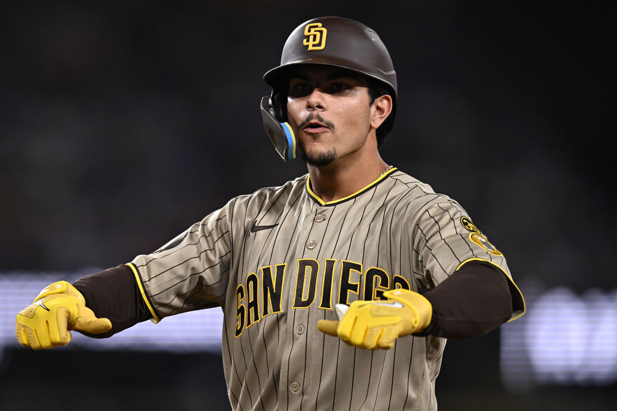 Sep 24, 2026; Los Angeles, California, USA; San Diego Padres catcher Ethan Salas (8) gestures after hitting an RBI single during the seventh inning against the Los Angeles Dodgers at Dodger Stadium. Mandatory Credit: William Liang-Imagn Images
