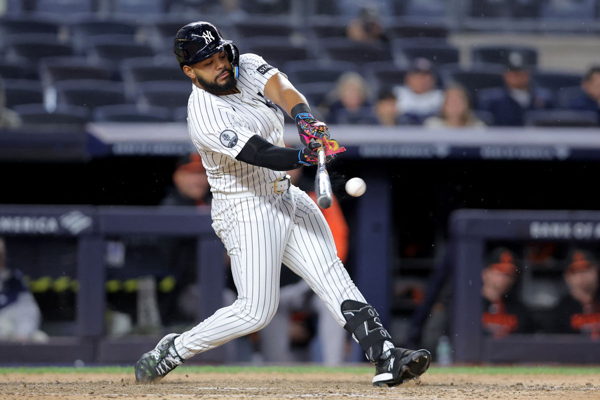 Sep 25, 2026; Bronx, New York, USA; New York Yankees left fielder Heliot Ramos (34) hits an RBI single against the Baltimore Orioles during the seventh inning at Yankee Stadium. Mandatory Credit: Brad Penner-Imagn Images