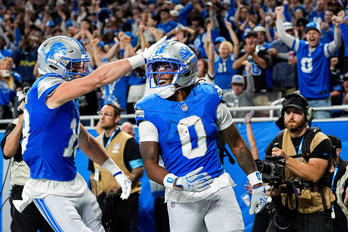 Detroit Lions running back Jahmyr Gibbs (0) celebrates a touchdown against New York Jets with wide receiver Isaac TeSlaa (18) during the second half at Ford Field in Detroit on Sunday, Sept. 27, 2026.