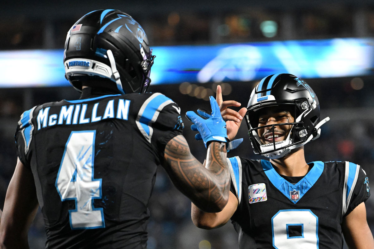 Oct 4, 2026; Charlotte, North Carolina, USA; Carolina Panthers wide receiver Tetairoa McMillan (4) celebrates with quarterback Bryce Young (9) after scoring a touchdown against the Detroit Lions during the third quarter at Bank of America Stadium. Mandatory Credit: Bob Donnan-Imagn Images