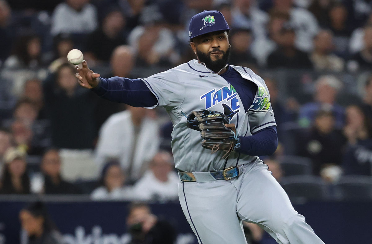 Oct 7, 2026; Bronx, New York, USA; Tampa Bay Rays third baseman Junior Caminero (13) throws to first during the third inning against the New York Yankees in game three of the ALDS for the 2026 MLB Playoffs at Yankee Stadium. Mandatory Credit: Wendell Cruz-Imagn Images