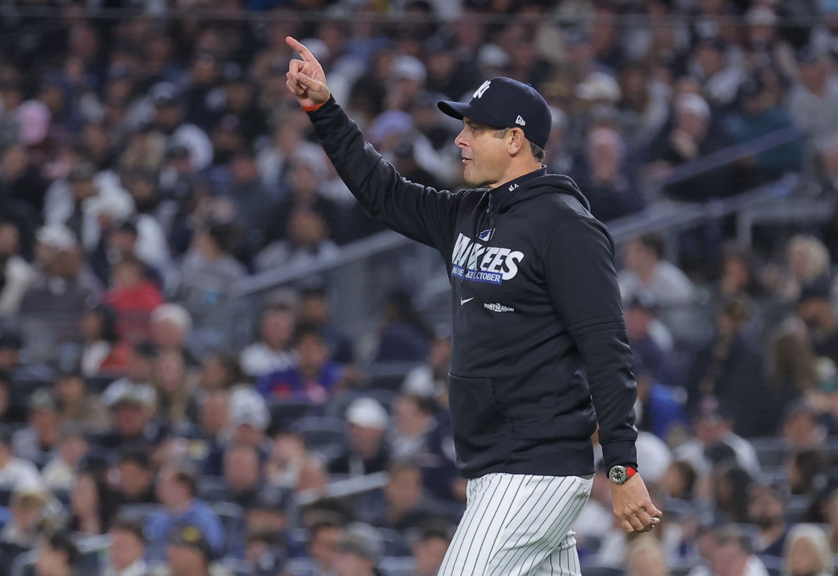 Oct 7, 2026; Bronx, New York, USA; New York Yankees manager Aaron Boone calls for a new pitcher during the eighth inning against the Tampa Bay Rays in game three of the ALDS for the 2026 MLB Playoffs at Yankee Stadium. Mandatory Credit: Brad Penner-Imagn Images