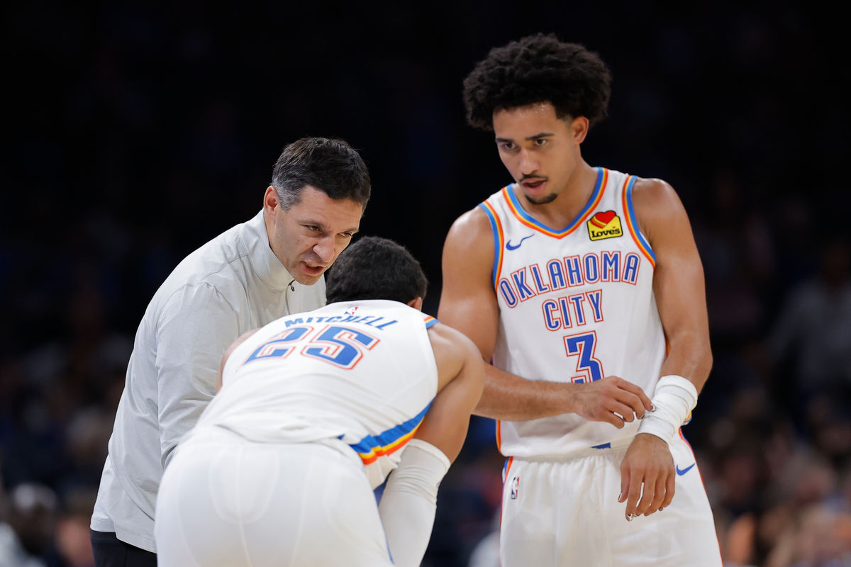 Oct 7, 2026; Oklahoma City, Oklahoma, USA; Oklahoma City Thunder head coach Mark Daigneault talks to Oklahoma City Thunder guard Ajay Mitchell (25) and guard Jared McCain (3) during the second half of a preseason game at Paycom Center. Mandatory Credit: Alonzo Adams-Imagn Images
