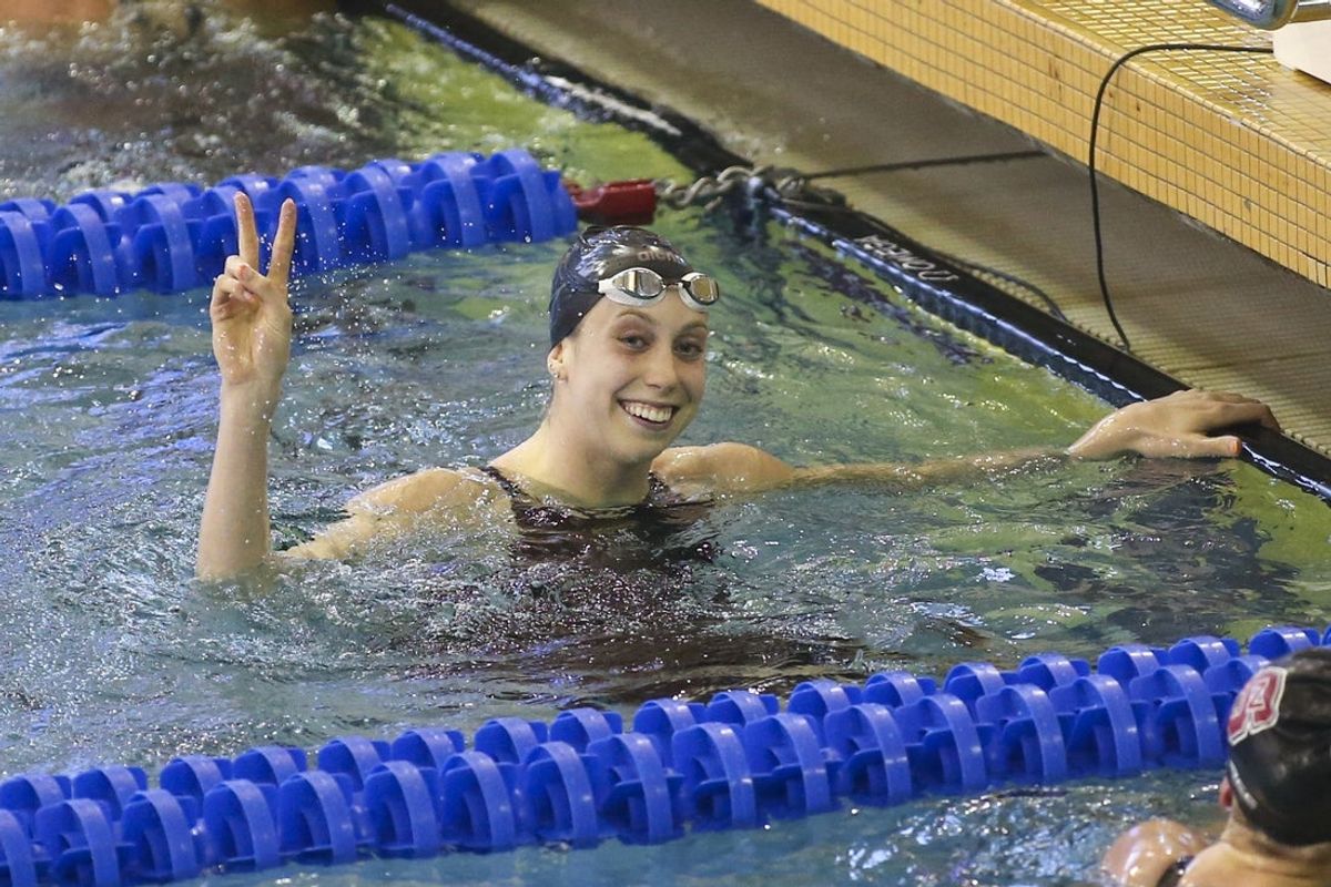 Mar 19, 2022; Atlanta, Georgia, USA; Virginia Cavaliers swimmer Gretchen Walsh celebrates after winning the 100 free at the NCAA Swimming & Diving Championships at Georgia Tech. Mandatory Credit: Brett Davis-Imagn Images