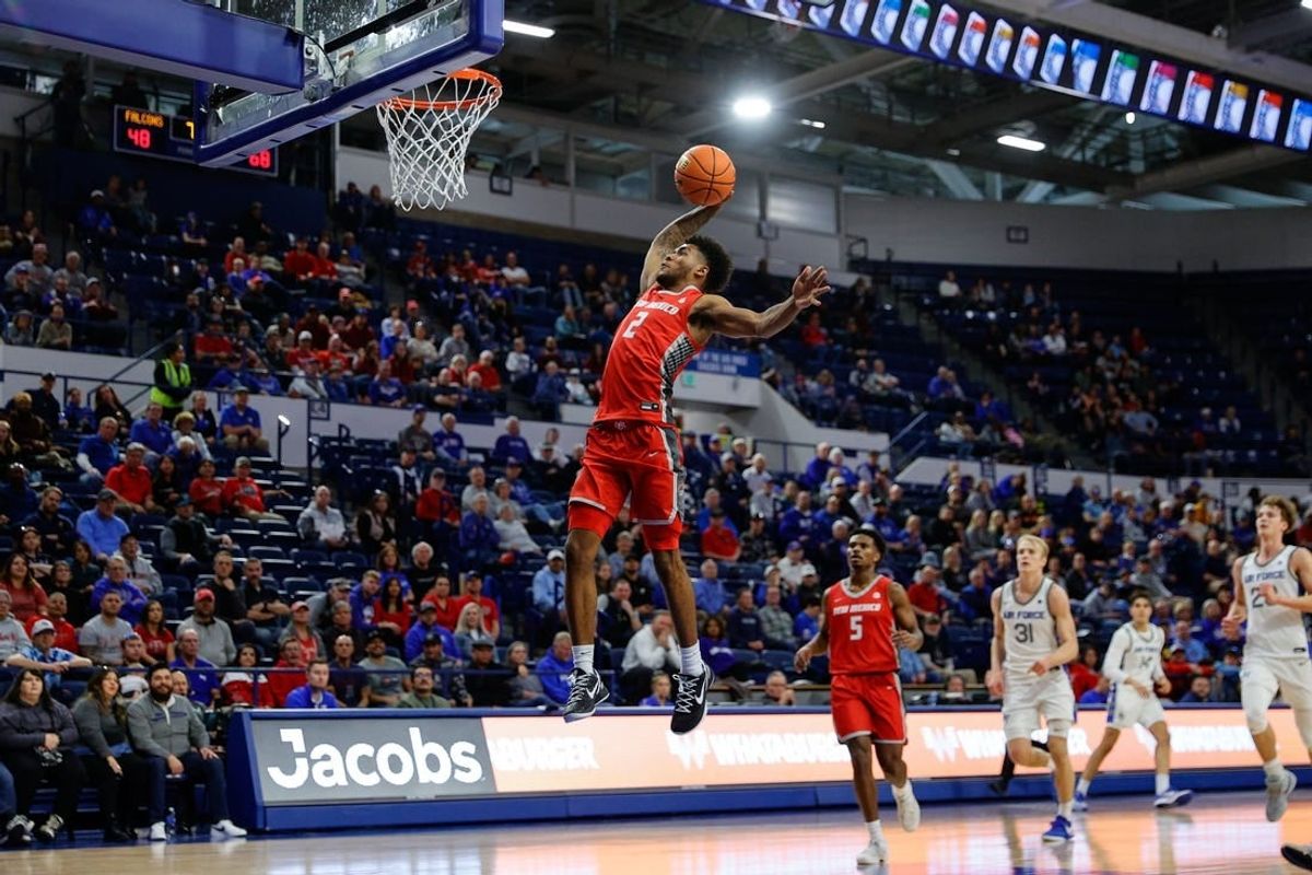 Jan 20, 2024; Colorado Springs, Colorado, USA; New Mexico Lobos guard Donovan Dent (2) dunks the ball in the second half against the Air Force Falcons at Clune Arena.