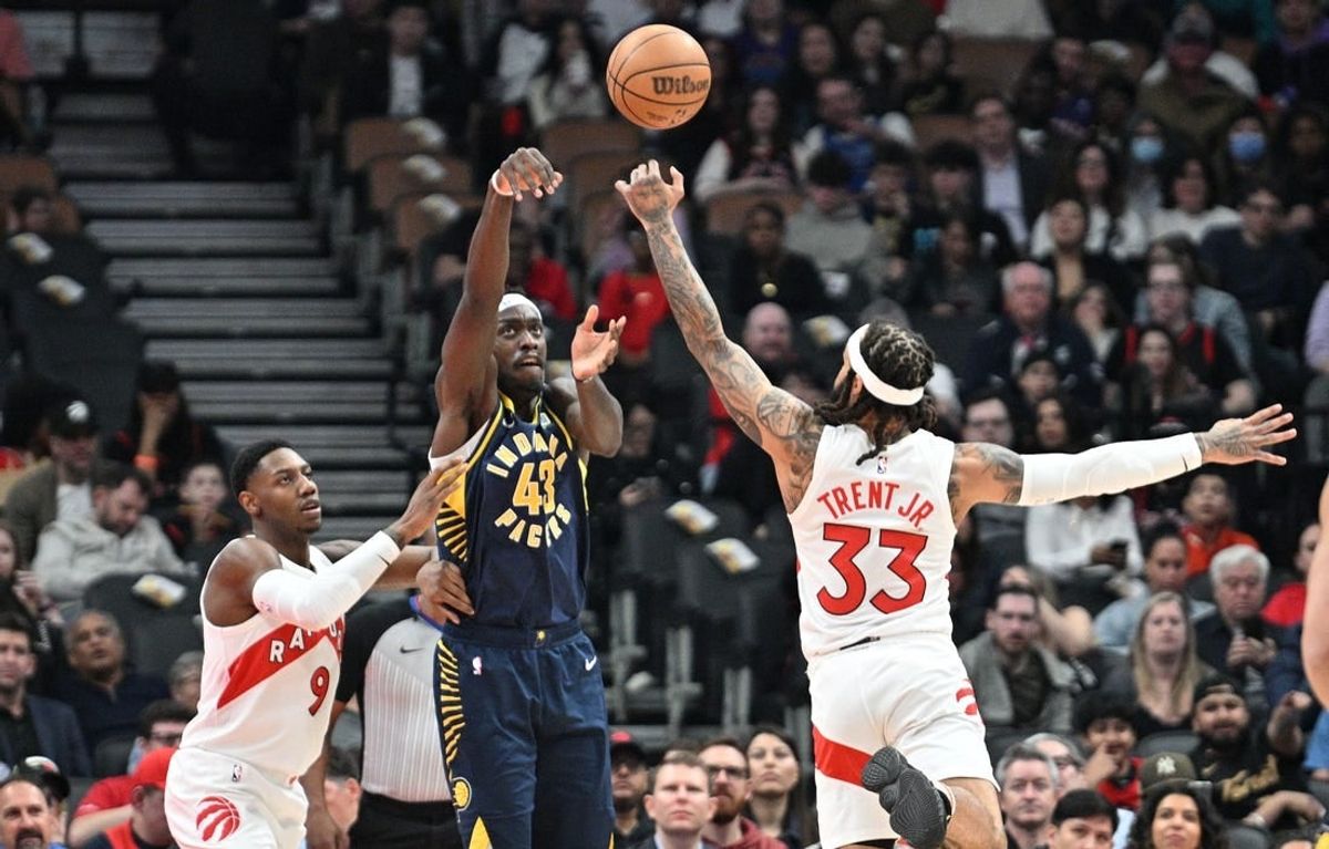 Apr 9, 2024; Toronto, Ontario, CAN;  Indiana Pacers forward Pascal Siakam (43) tries to pass the ball as Toronto Raptors forward RJ Barrett (9) and guard Gary Trent Jr. (33) defend in the first half at Scotiabank Arena.