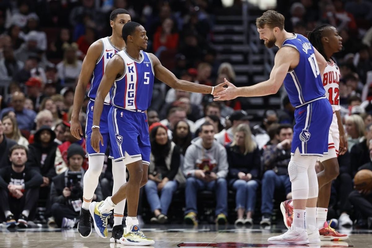 Feb 3, 2024; Chicago, Illinois, USA; Sacramento Kings guard De'Aaron Fox (5) celebrates with forward Domantas Sabonis (10) after scoring against the Chicago Bulls during the first half at United Center.