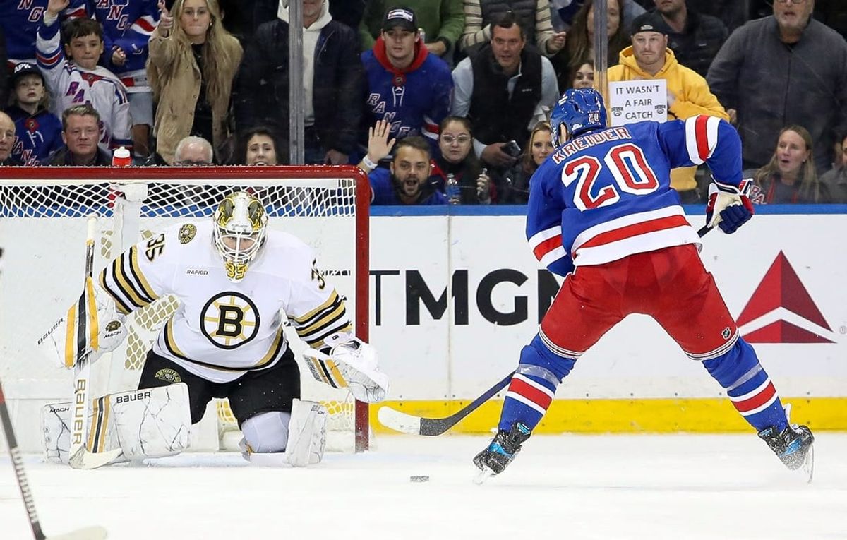 Nov 25, 2023; New York, New York, USA; New York Rangers left wing Chris Kreider (20) takes a shot at Boston Bruins goalie Linus Ullmark (35) during the third period at Madison Square Garden.