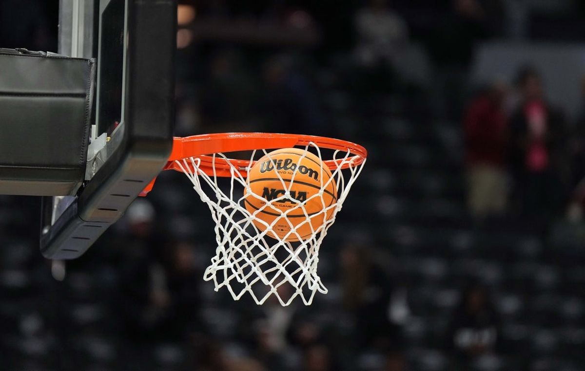 Apr 3, 2022; Minneapolis, MN, USA; A NCAA Wilson basketball drops through the net. Mandatory Credit: Kirby Lee-Imagn Images