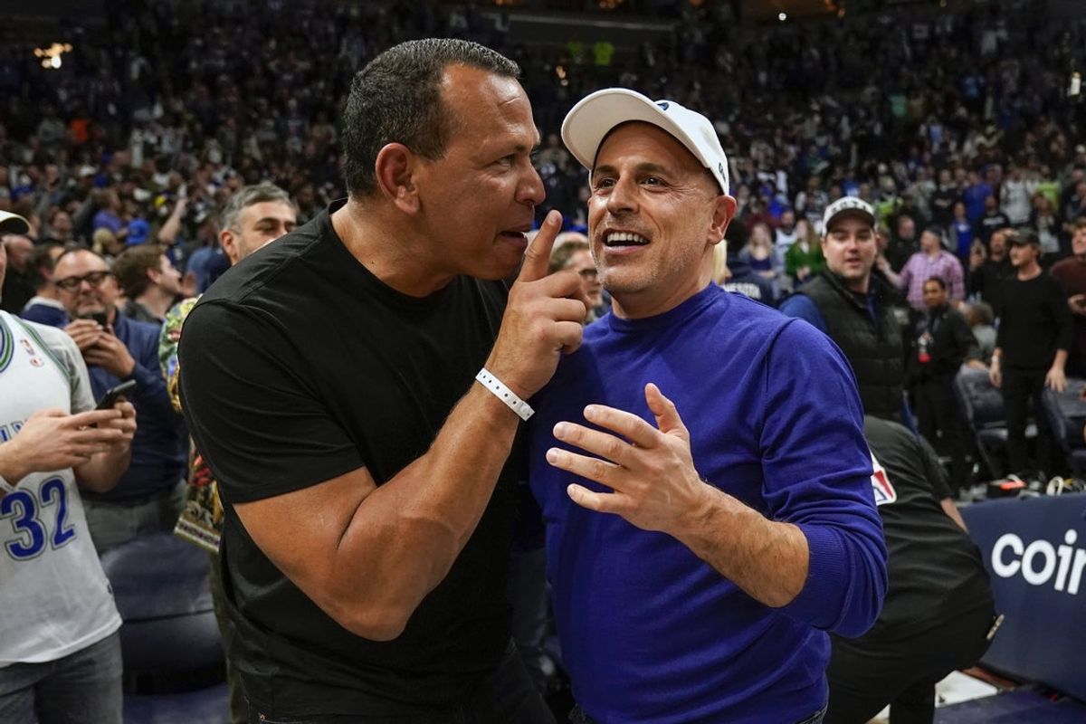 Apr 12, 2022; Minneapolis, Minnesota, USA;  Minnesota Timberwolves co-minority owners Alex Rodriguez and Marc Lore celebrate a victory over the Los Angeles Clippers after a play-in game at Target Center. Mandatory Credit: Nick Wosika-Imagn Images