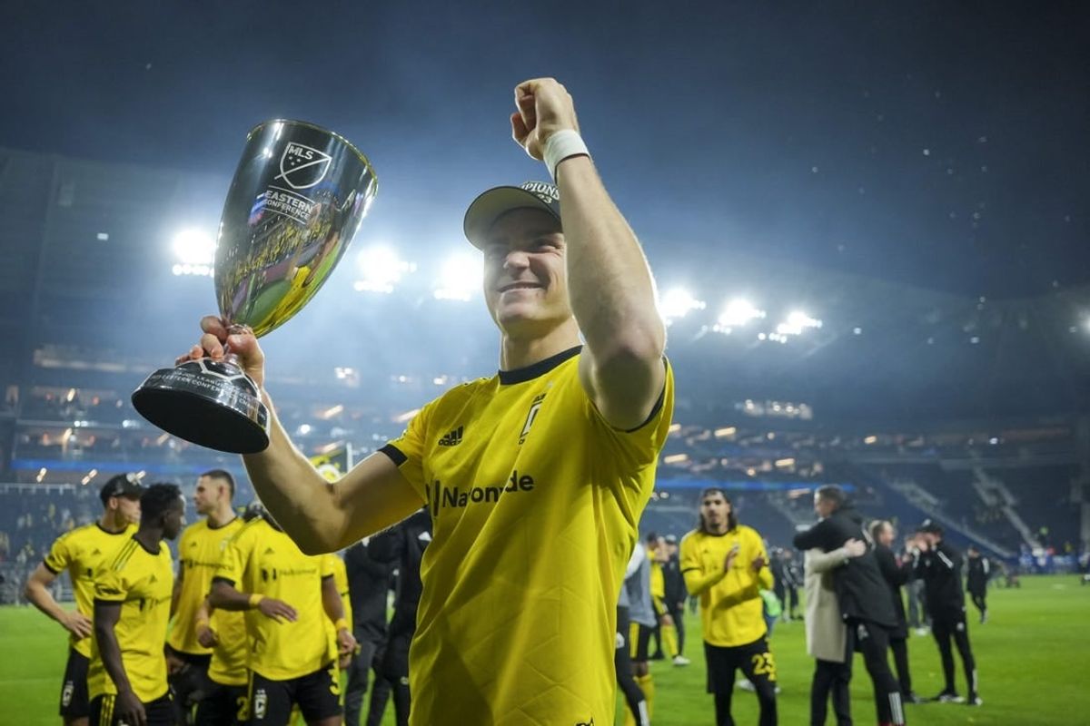 Dec 2, 2023; Cincinnati, Ohio, USA;  Columbus Crew defender Julian Gressel (7) celebrates with the trophy after defeating FC Cincinnati at TQL Stadium.