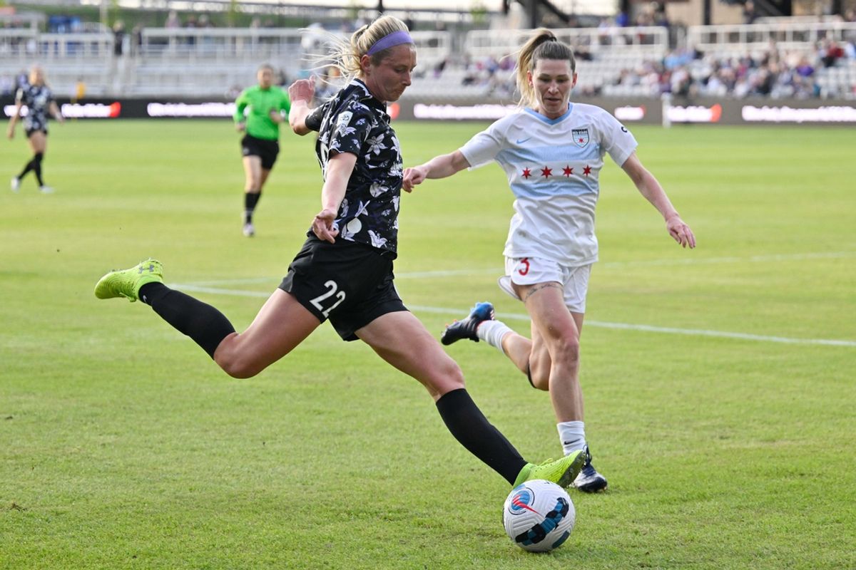Apr 16, 2022; Louisville, KY, USA;  Racing Louisville FC forward Kirsten Davis (22) shoots against Chicago Red Stars defender Arin Wright (3) at Lynn Family Stadium. Mandatory Credit: Jamie Rhodes-USA TODAY Sports
