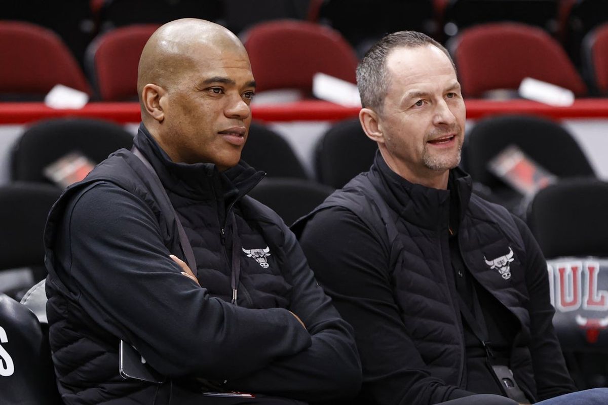 Apr 22, 2022; Chicago, Illinois, USA; Chicago Bulls executive vice president of basketball operations Arturas Karnisovas (right) talks with general manager Marc Eversley (left) before game three of the first round for the 2022 NBA playoffs against the Milwaukee Bucks at United Center. Mandatory Credit: Kamil Krzaczynski-Imagn Images