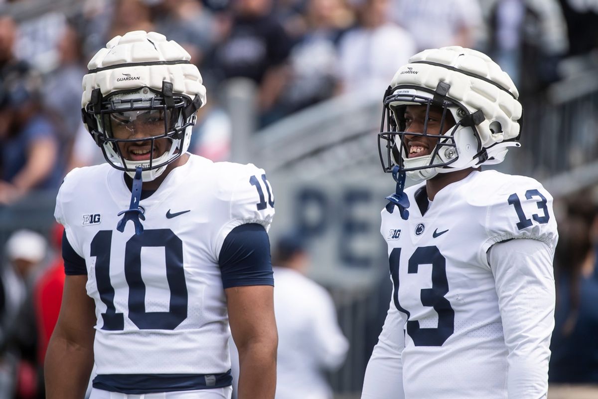 Penn State freshman running backs Nicholas Singleton (10) and Kaytron Allen share a laugh together as they warm up before the 2022 Blue-White game at Beaver Stadium on Saturday, April 23, 2022, in State College.

Hes Dr 042322 Bluewhite