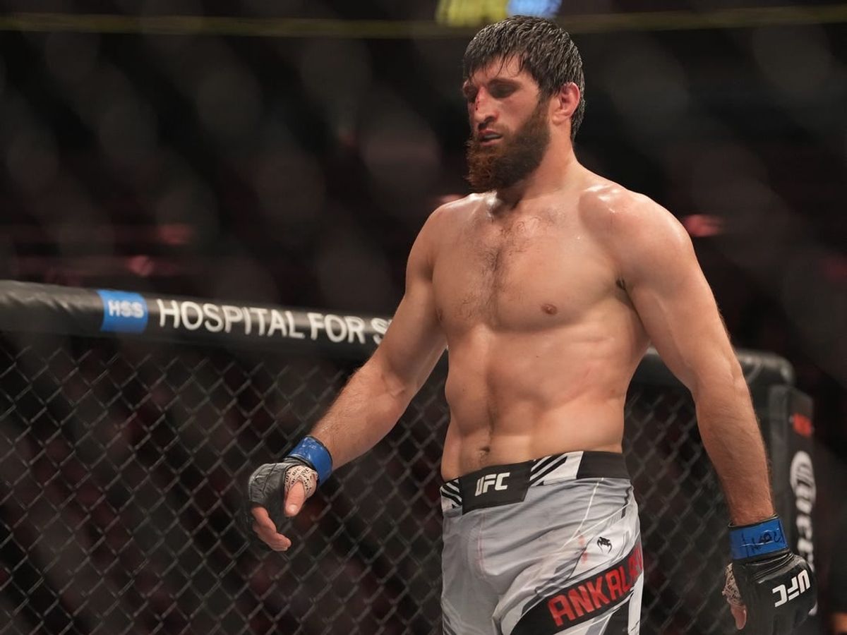 Dec 10, 2022; Las Vegas, Nevada, USA;  Magomed Ankalaev (blue gloves) reacts during the fight against Jan Blachowicz (red gloves) during UFC 282 at T-Mobile Arena.