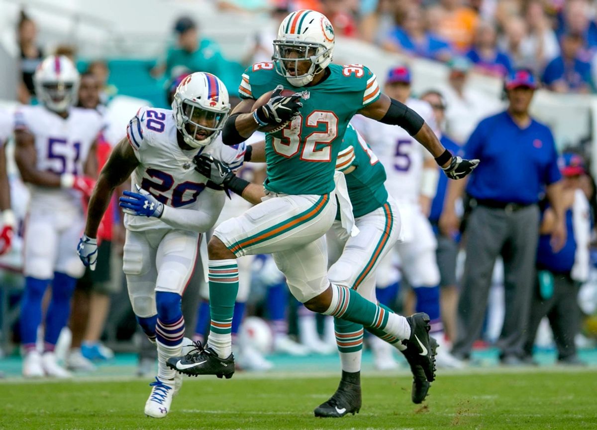 Miami Dolphins running back Kenyan Drake (32), runs for a first down against the Buffalo Bills during second half action of their NFL game Sunday Dec. 3, 2018, in Miami Gardens. [BILL INGRAM/palmbeachpost.com]

1017376088 Dolphins Drake Aqua
