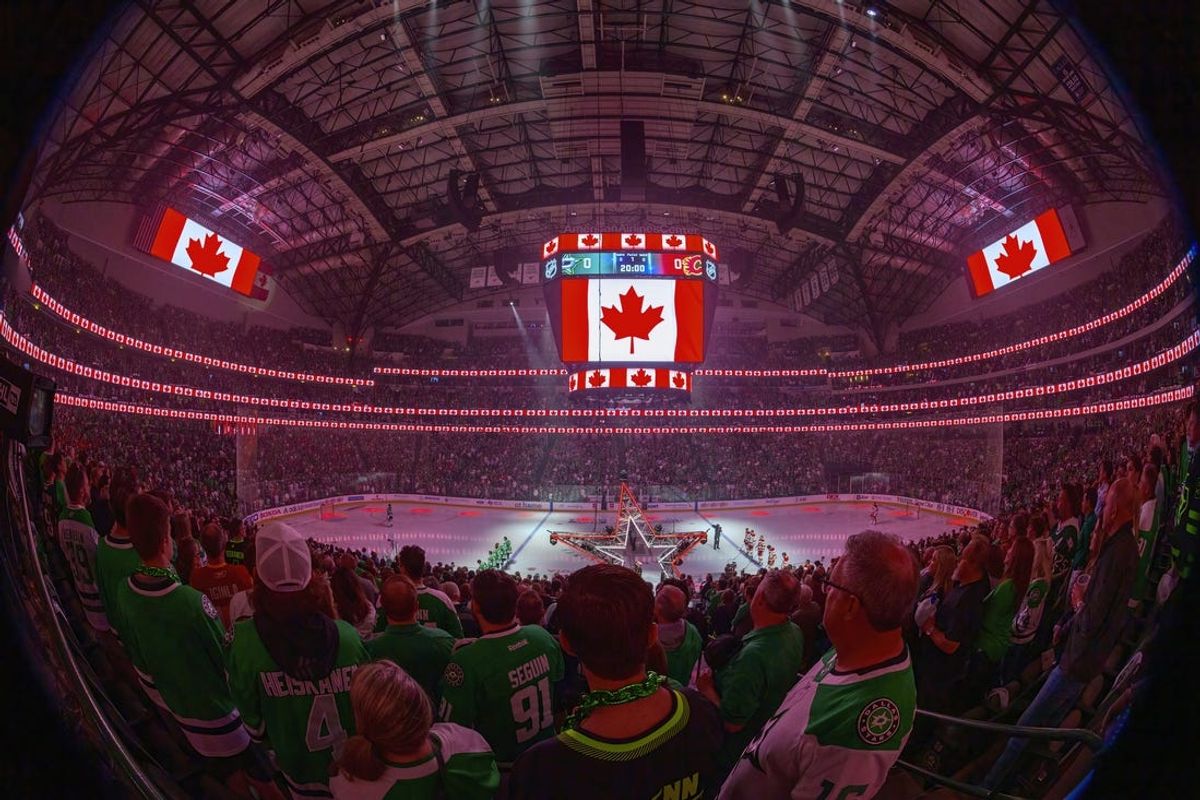 May 9, 2022; Dallas, Texas, USA; A view of the fans and the arena and the Canadian flag during the playing of the Canadian national anthem before the game between the Dallas Stars and the Calgary Flames in game four of the first round of the 2022 Stanley Cup Playoffs at American Airlines Center. Mandatory Credit: Jerome Miron-USA TODAY Sports