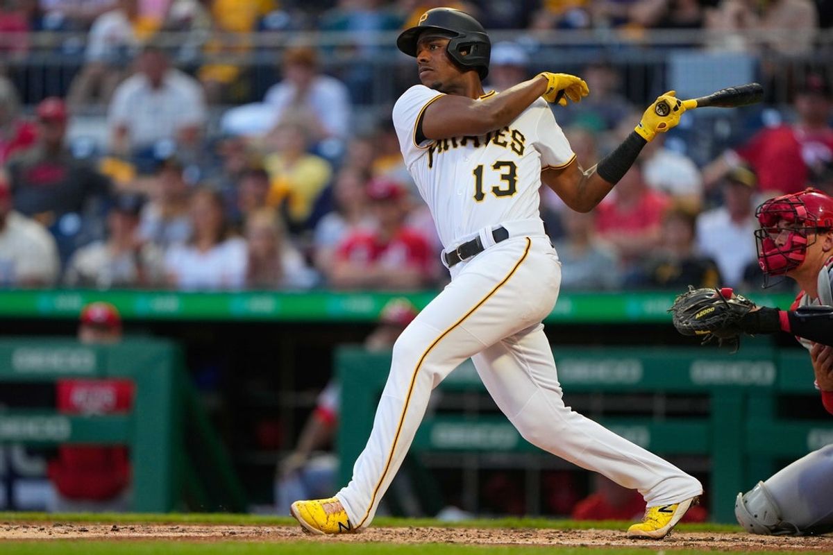 May 13, 2022; Pittsburgh, Pennsylvania, USA; Pittsburgh Pirates third baseman Ke   Bryan Hayes (13) hits an RBI double against the Cincinnati Reds during the third inning at PNC Park. Mandatory Credit: Gregory Fisher-Imagn Images