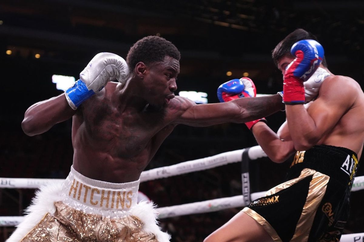 May 21, 2022; Glendale, Arizona, USA; Richardson Hitchins (gold trunks) and Angel Rodriguez (black trunks) box during a Premier Boxing Champions card at Gila River Arena. Mandatory Credit: Joe Camporeale-Imagn Images