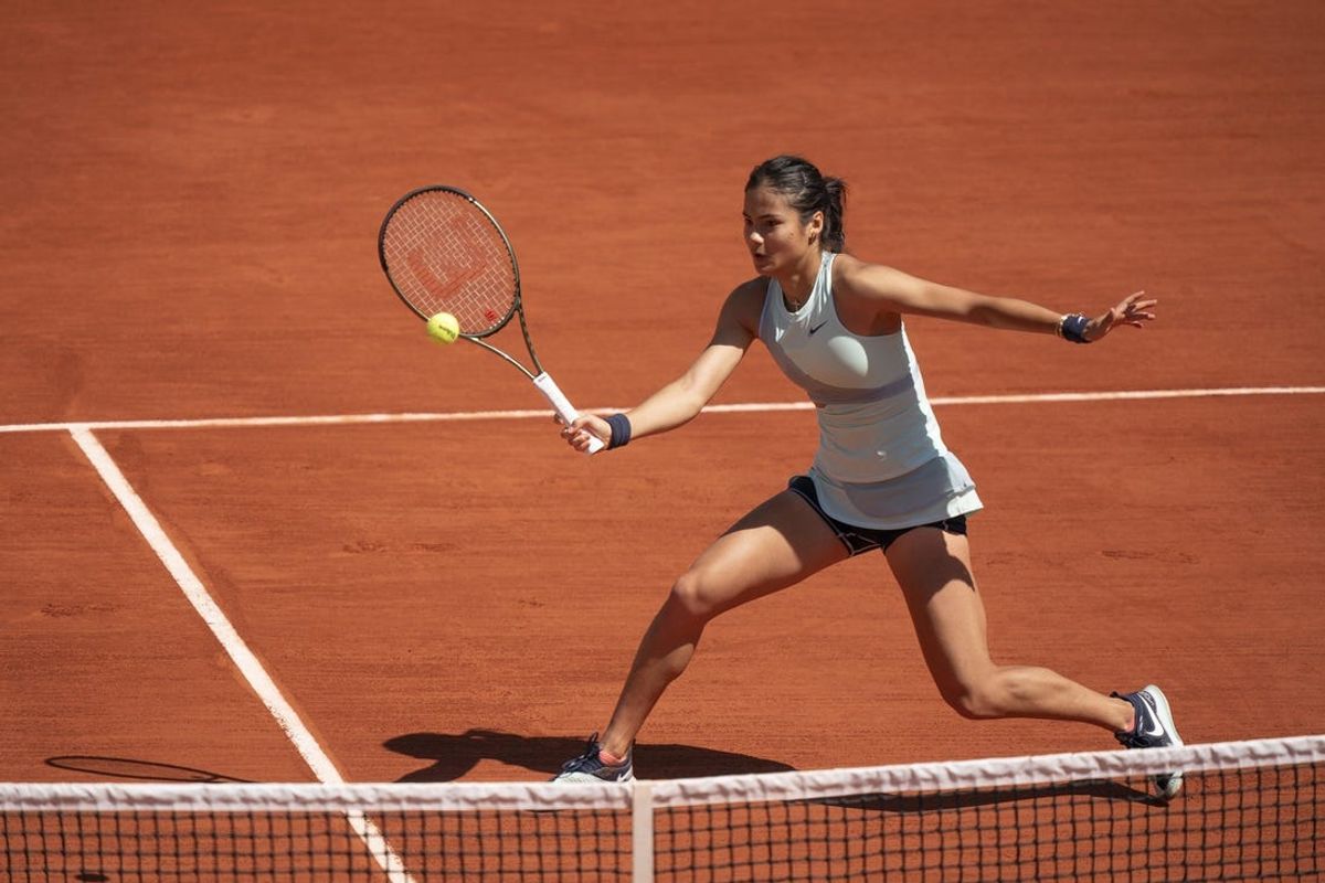 May 25, 2022; Paris, France; Emma Raducanu (GBR) returns a shot from Aliaksandra Sasnovich during their match on day four of the French Open at Stade Roland-Garros. Mandatory Credit: Susan Mullane-USA TODAY Sports