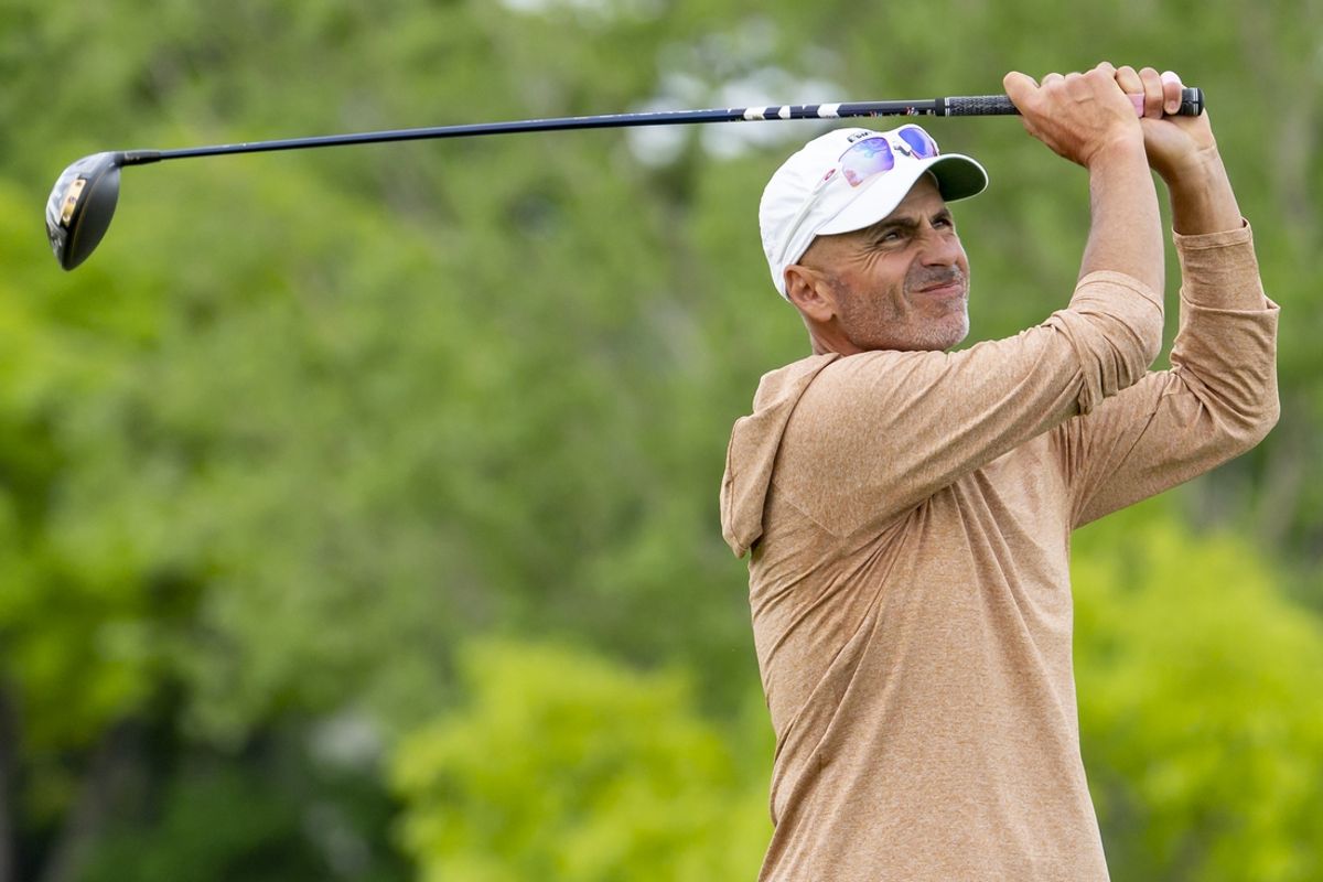 May 26, 2022; Benton Harbor, Michigan, USA; Rocco Mediate hits his tee shot on the eighth hole during the first round of the 2022 KitchenAid Senior PGA Championship at Harbor Shores. Mandatory Credit: Raj Mehta-Imagn Images