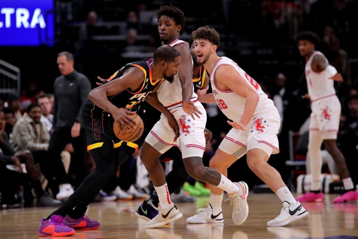 Dec 27, 2023; Houston, Texas, USA; Phoenix Suns forward Kevin Durant (35) handles the ball against Houston Rockets center Alperen Sengun (28) during the second quarter at Toyota Center.