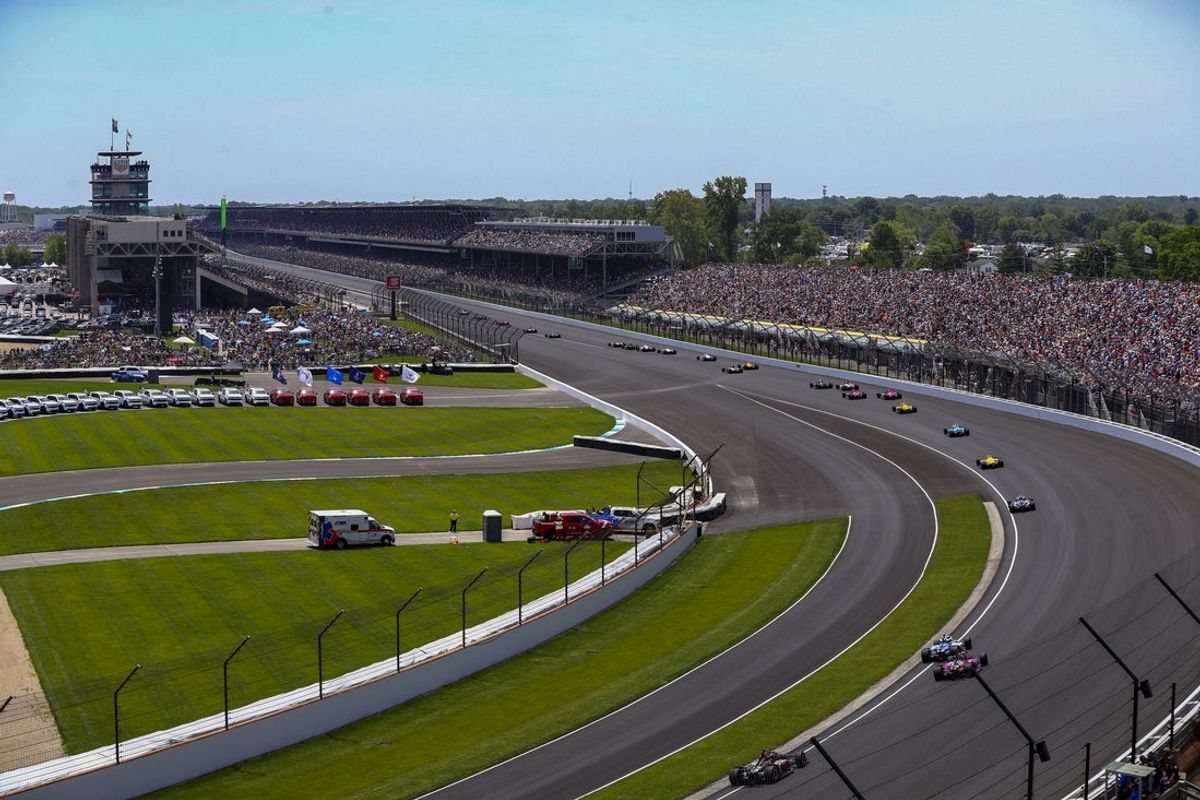 May 29, 2022; Indianapolis, Indiana, USA; A view of the race fans and the grand stands and the field of drivers during the running of the 106th Indianapolis 500 at Indianapolis Motor Speedway. Mandatory Credit: Guy Rhodes-Imagn Images