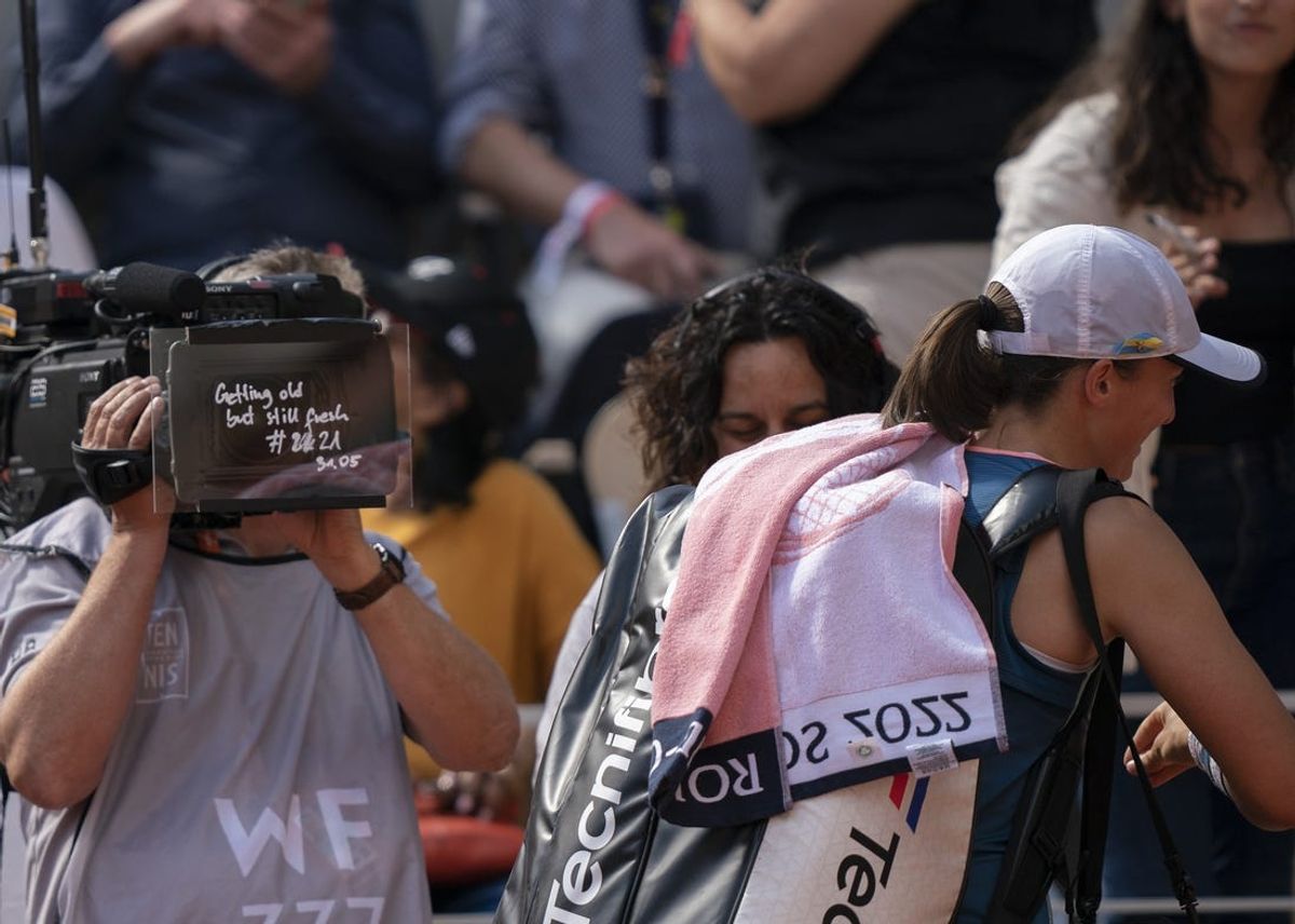 June 1, 2022; Paris, France; Iga Swiatek (POL) writes  Getting old but still fresh  on the tv screen after her match against Jessica Pegula (USA) on day 11 of the French Open at Stade Roland-Garros. Mandatory Credit: Susan Mullane-USA TODAY Sports