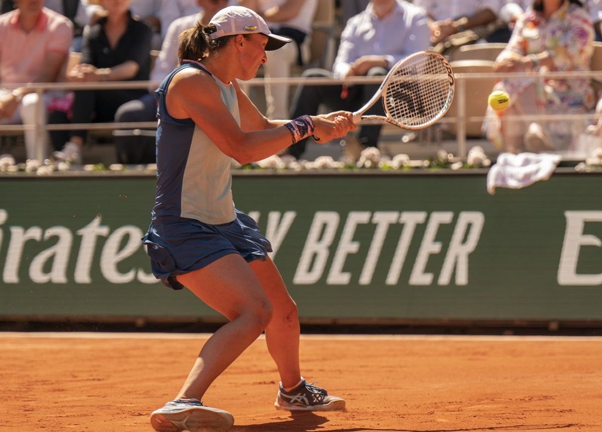 June 2, 2022; Paris, France; Iga Swiatek (POL) returns a shot during her semifinal match against Daria Kasatkina on day 12 of the French Open at Stade Roland-Garros. Mandatory Credit: Susan Mullane-Imagn Images