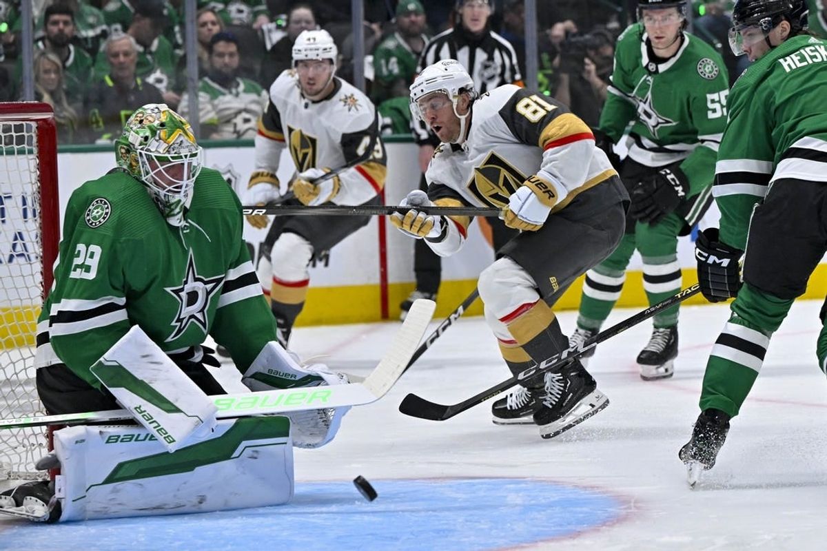 Apr 22, 2024; Dallas, Texas, USA; Vegas Golden Knights right wing Jonathan Marchessault (81) scores a goal against Dallas Stars goaltender Jake Oettinger (29) during the first period in game one of the first round of the 2024 Stanley Cup Playoffs at the American Airlines Center.