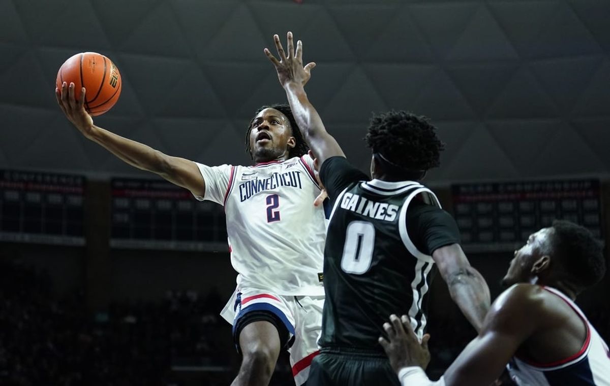 Jan 31, 2024; Storrs, Connecticut, USA; UConn Huskies guard Tristen Newton (2) shoots against Providence Friars guard Davonte Gaines (0) in the first half at Harry A. Gampel Pavilion.