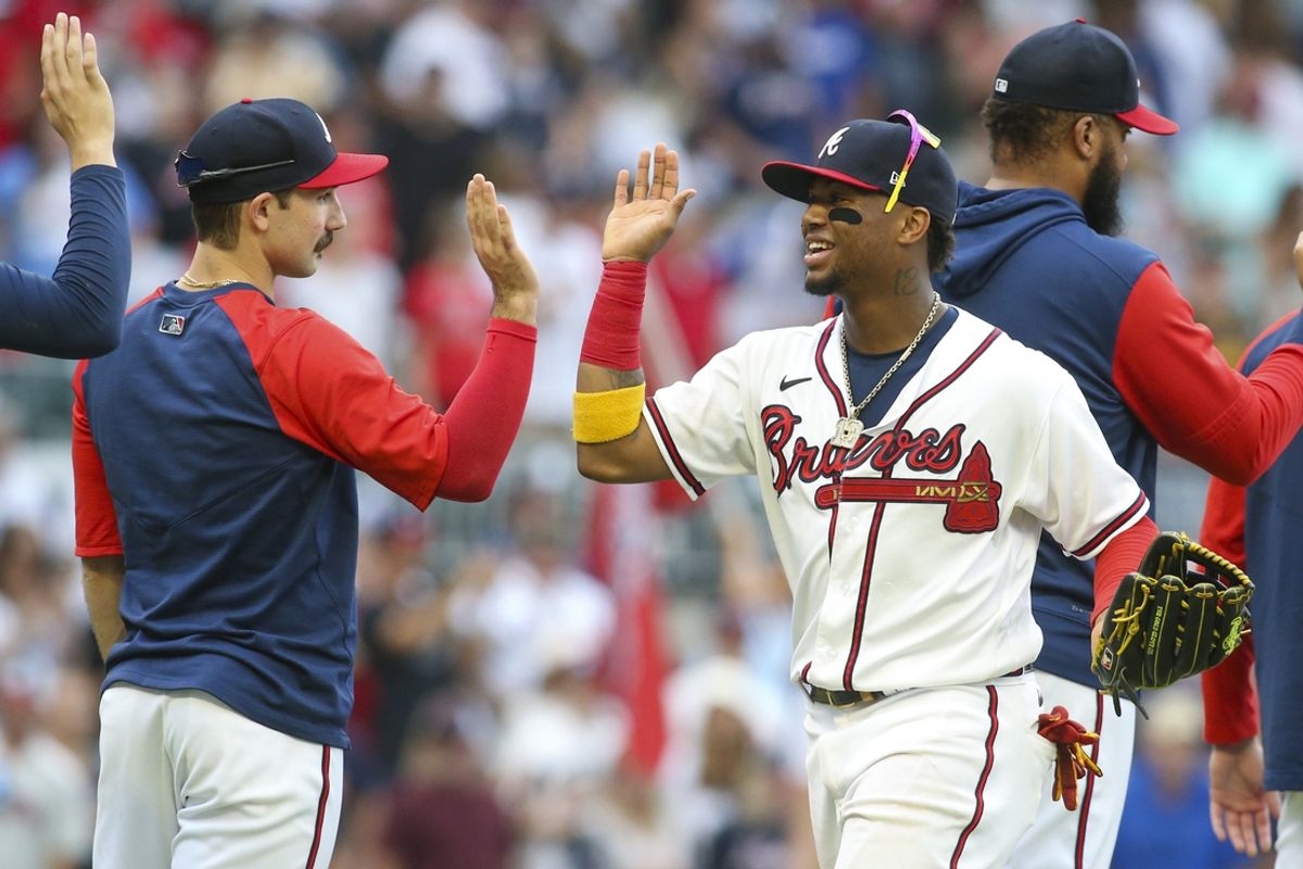 Jun 11, 2022; Atlanta, Georgia, USA; Atlanta Braves starting pitcher Spencer Strider (65) and right fielder Ronald Acuna Jr. (13) celebrate after a victory against the Pittsburgh Pirates at Truist Park. Mandatory Credit: Brett Davis-Imagn Images