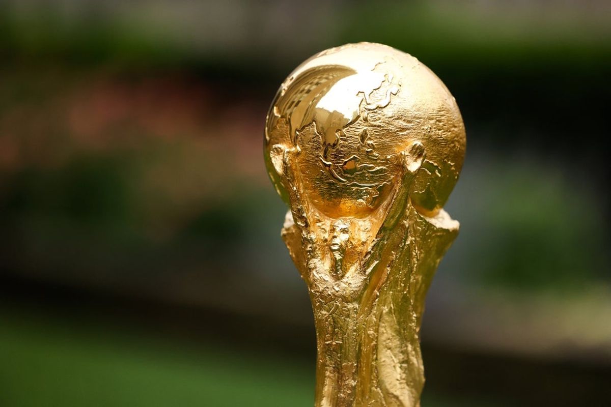 Jun 16, 2022; New York, New York, USA; A detail view of The FIFA World Cup Trophy sits on a stand outside of 30 Rockefeller Plaza.  Mandatory Credit: Jessica Alcheh-Imagn Images