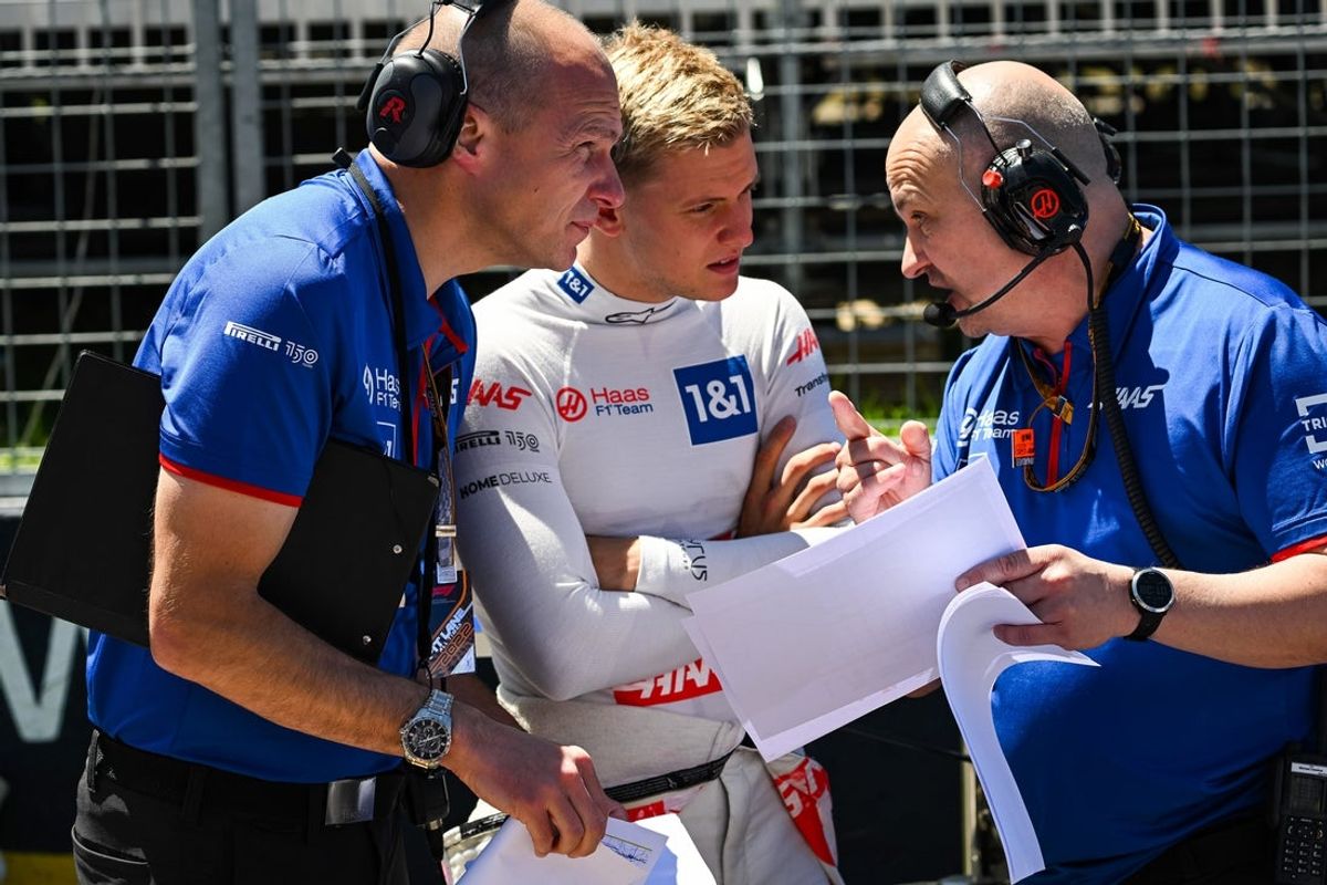 Jun 19, 2022; Montreal, Quebec, CAN; Haas Team driver Mick Schumacher of Germany discusses with his engineer on the starting grid before the Montreal Grand Prix at Circuit Gilles Villeneuve. Mandatory Credit: David Kirouac-Imagn Images